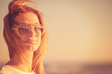 Image showing Young woman enjoying the warm autumn day