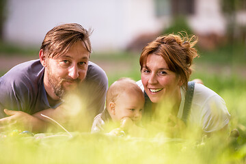 Image showing hipster family relaxing in park