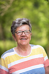 Image showing happy  senior woman with eyeglasses