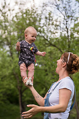 Image showing woman with baby  in nature