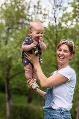 Image showing woman with baby  in nature