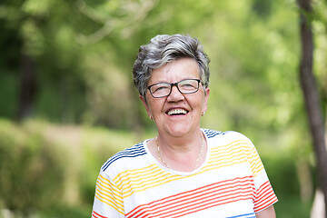 Image showing happy  senior woman with eyeglasses