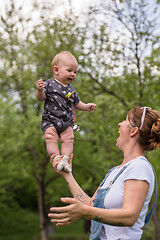 Image showing woman with baby  in nature