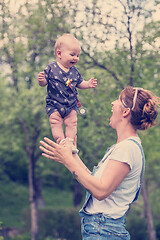 Image showing woman with baby  in nature