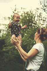 Image showing woman with baby  in nature