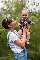 Image showing woman with baby  in nature