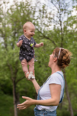 Image showing woman with baby  in nature