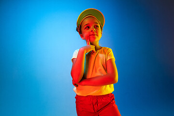 Image showing Young serious thoughtful teen girl. Doubt concept.