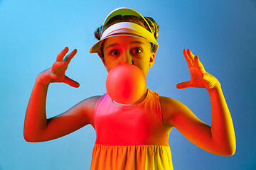 Image showing Young girl blowing bubble gum