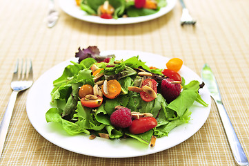 Image showing Green salad with berries and tomatoes