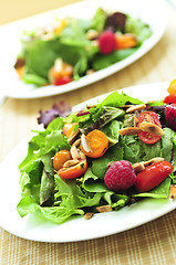 Image showing Green salad with berries and tomatoes