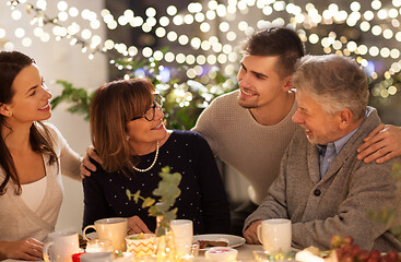 Image showing happy family having tea party at home