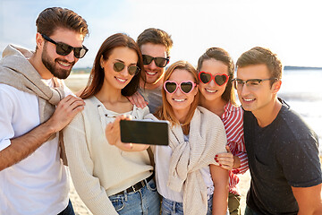 Image showing happy friends taking selfie on summer beach