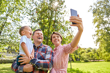 Image showing happy family taking selfie at summer park