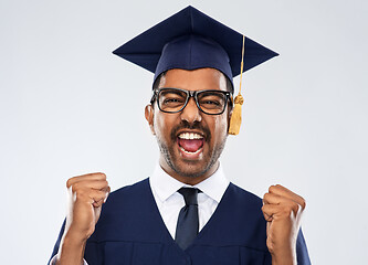 Image showing happy indian graduate student celebrating success