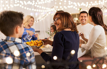 Image showing happy family having dinner party at home