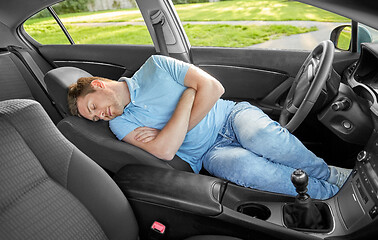 Image showing tired man or driver sleeping in car