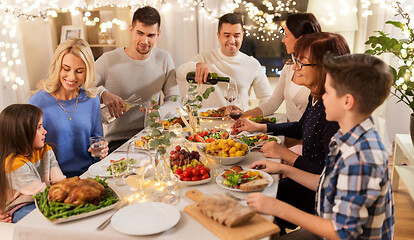 Image showing happy family having dinner party at home