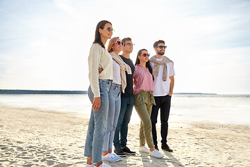 Image showing happy friends on summer beach