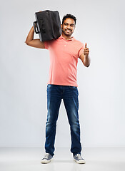 Image showing smiling indian man with travel bag on shouder