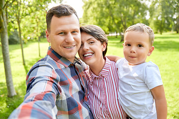 Image showing happy family taking selfie at summer park