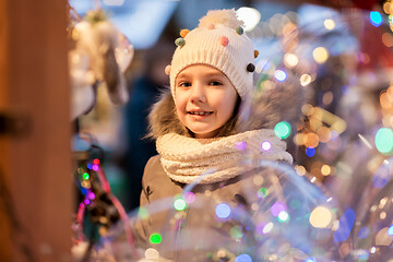 Image showing happy little girl at christmas market in winter