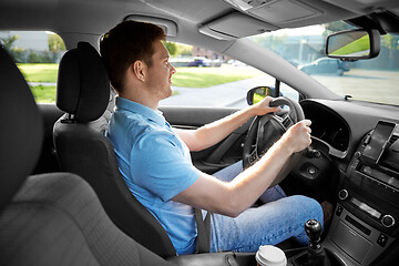 Image showing smiling man or driver driving car