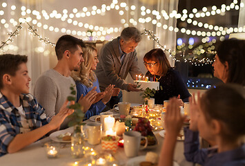 Image showing happy family having birthday party at home