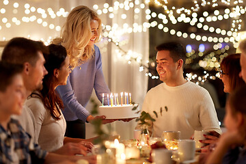 Image showing happy family with cake having birthday party