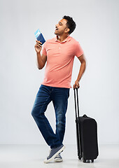 Image showing indian man with travel bag passport and air ticket