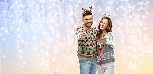 Image showing happy couple at christmas ugly sweater party