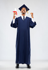 Image showing male graduate student in mortar board with diploma