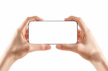 Image showing Young girl hands holding black smart phone on white 