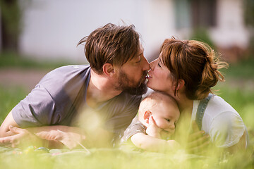 Image showing hipster family relaxing in park