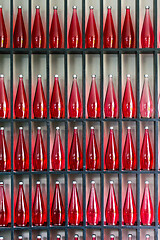 Image showing bottles of red juice in modern restaurant