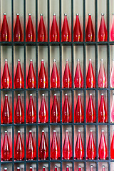 Image showing bottles of red juice in modern restaurant