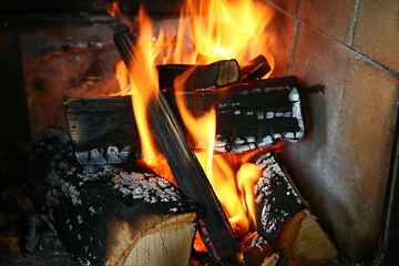 Image showing fire with wood in a cast iron stove