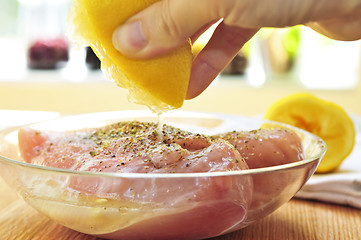 Image showing Raw chicken breasts marinating