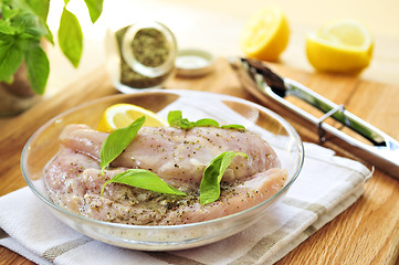 Image showing Raw chicken breasts marinating