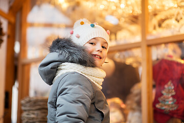 Image showing happy little girl at christmas market in winter