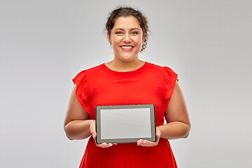 Image showing happy woman in red dress holding tablet computer