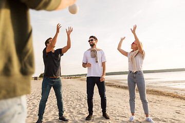 Image showing friends playing volleyball on beach in summer