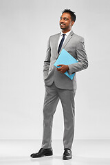 Image showing indian businessman with folder over grey