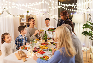 Image showing happy family having dinner party at home