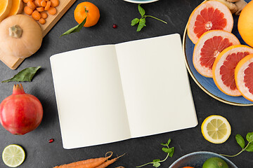 Image showing close up of notebook, fruits and vegetables