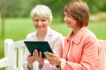 Image showing senior women with tablet pc at summer park