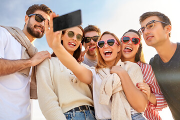 Image showing happy friends taking selfie in summer