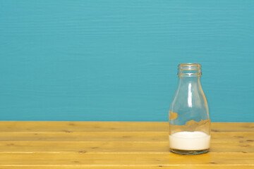 Image showing One-third pint glass bottle with dregs of fresh milk