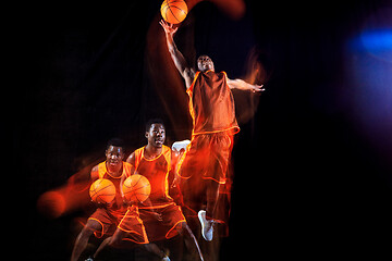 Image showing Young basketball player against dark background