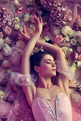 Image showing Young woman in pink ballet tutu surrounded by flowers